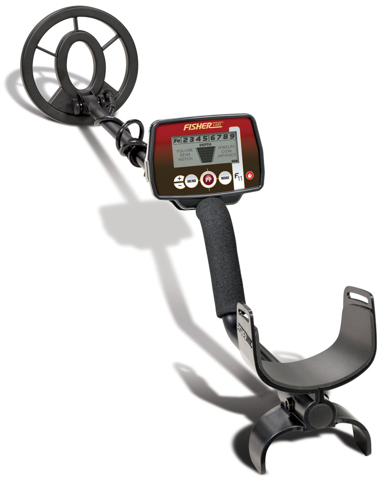 A full, angled view of the Fisher Labs F11 metal detector, showcasing its black search coil, red and black control box with a digital display, and ergonomic armrest, set against a white background.
