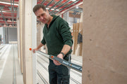 Nedo mEsstronic 2 digital measure used by man measuring wooden beam on construction site