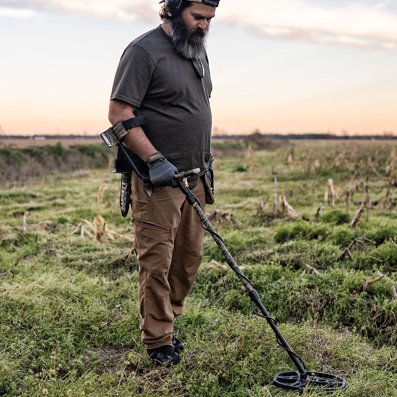 Jase Robertson detecting with the Garrett ACE Apex camo Signature Edition in a field