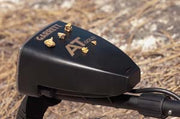 Gold nuggets resting on the Garrett AT Gold control housing