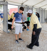 Garrett SuperWand used to screen a person at a checkpoint